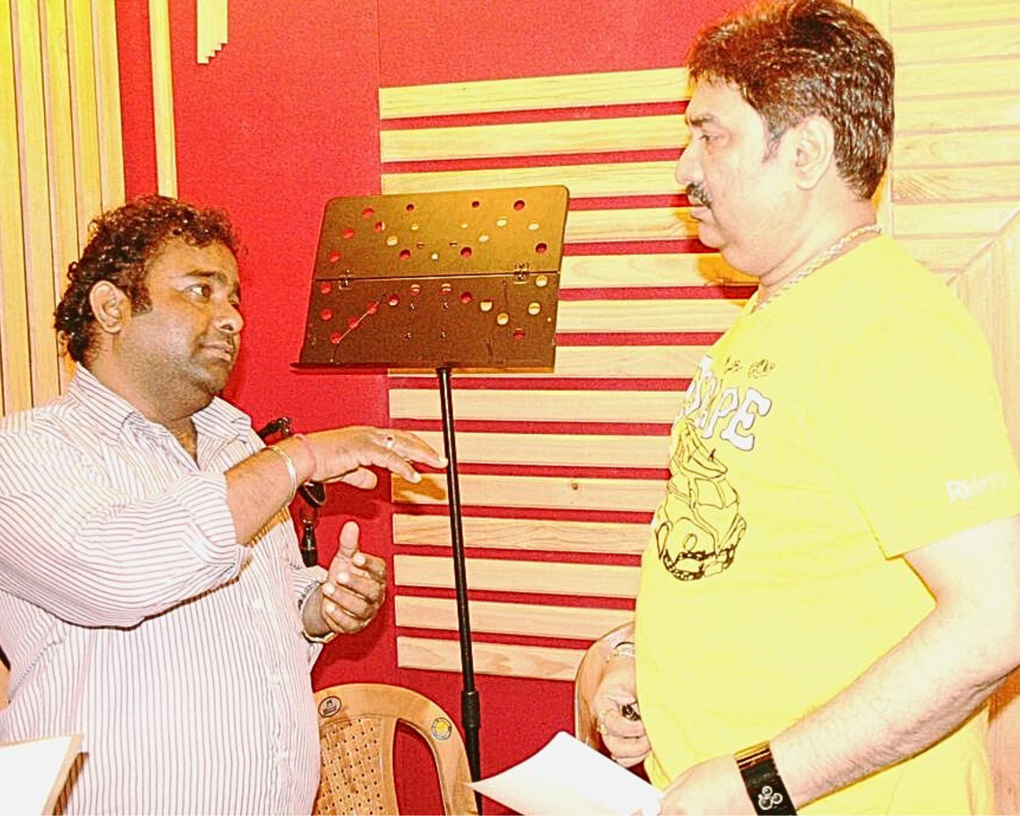 Veivek Asthaana explaining to Kumar Shanu during a song dubbing